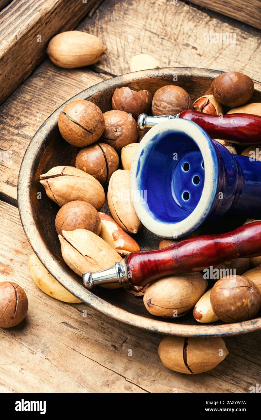 Oriental tobacco hookah with nut shisha tobacco.Nuts shisha tobacco Stock  Photo