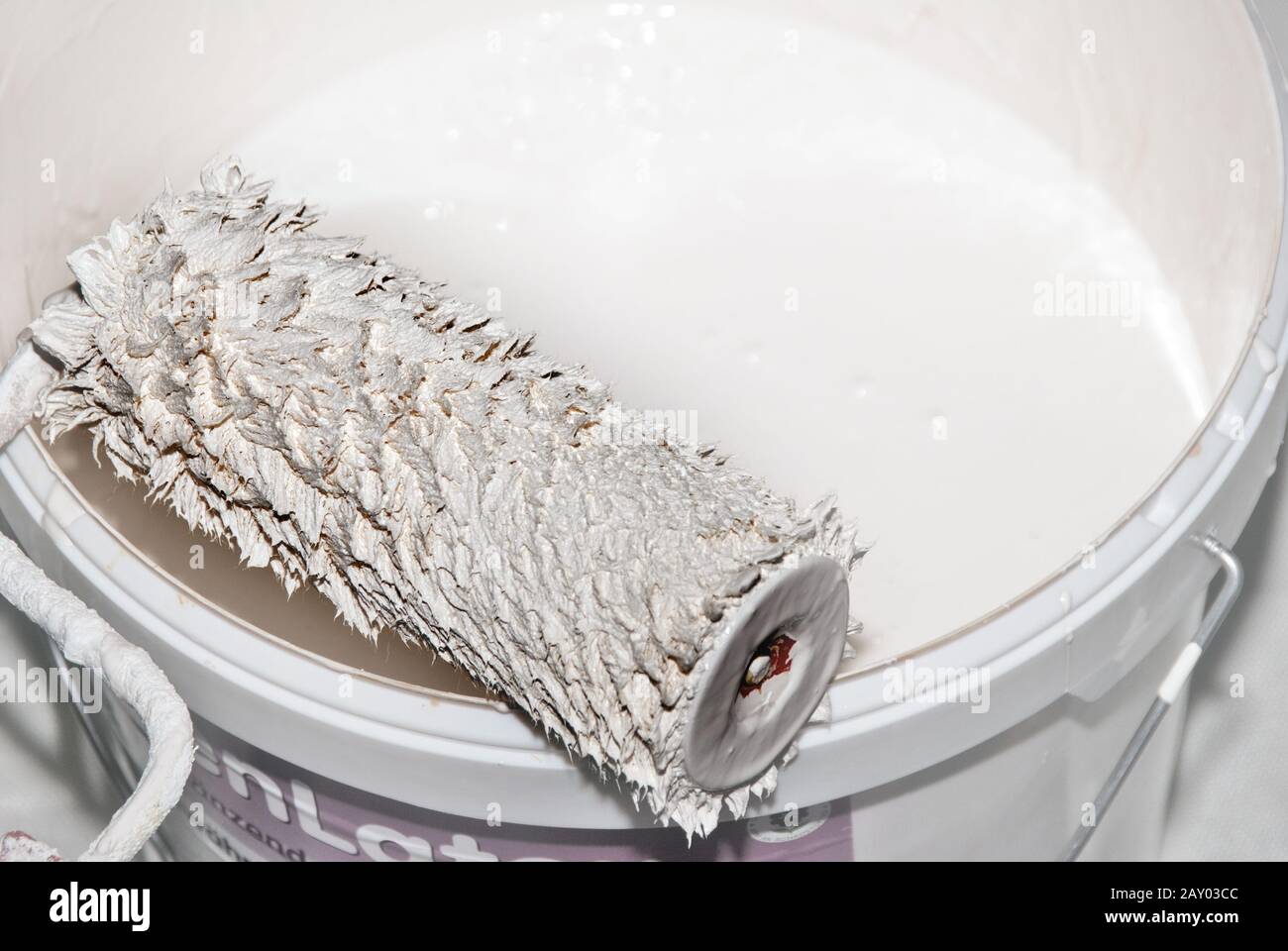 Paint roller and paint bucket Stock Photo
