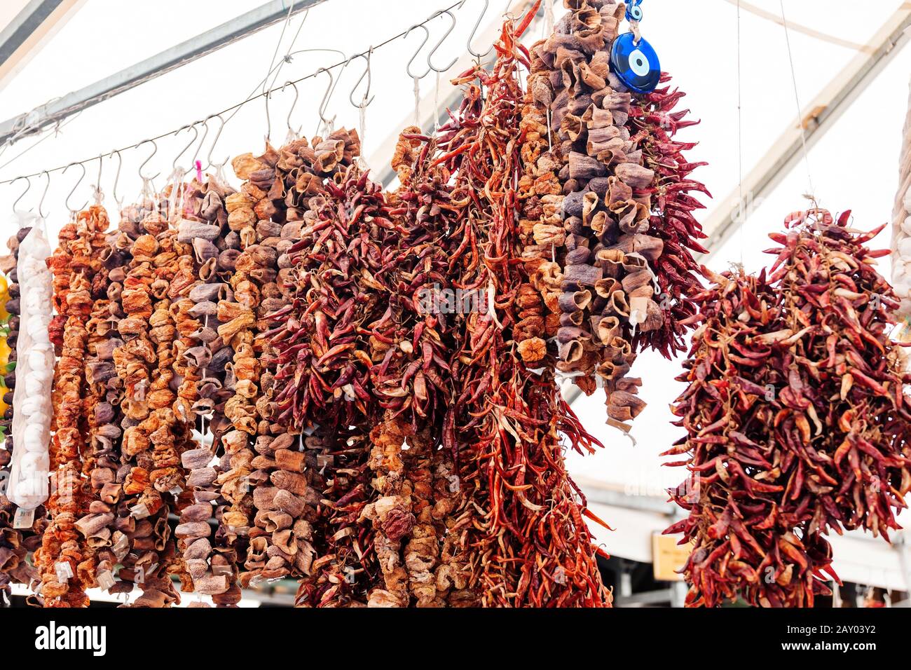 Dry peppers hanging on a market stall Stock Photo - Alamy