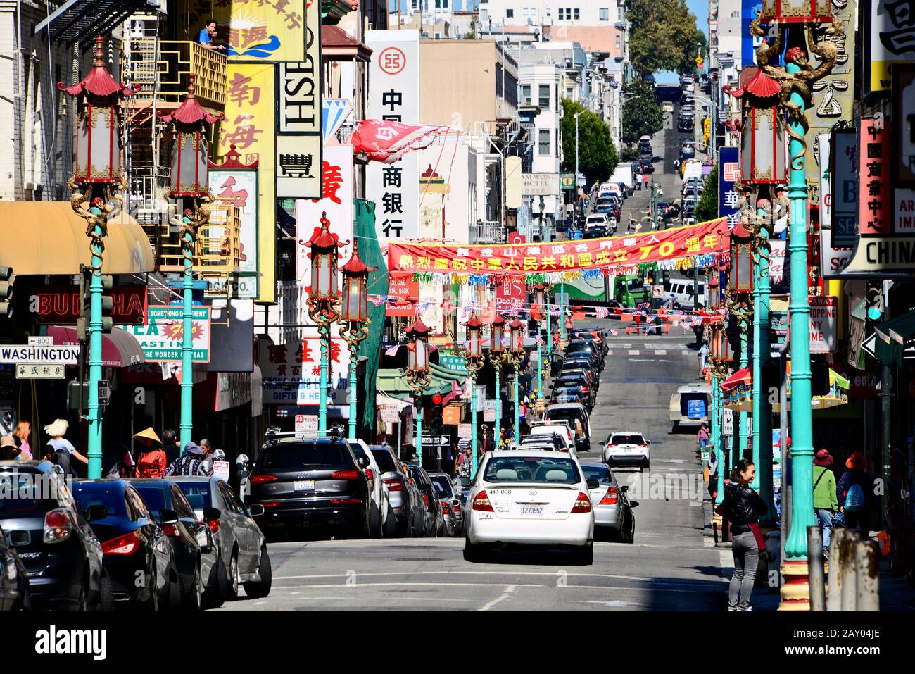 Grant Avenue with Chinese advertising, American and Chinese flags in Chinatown, San Francisco, California, USA Stock Photo
