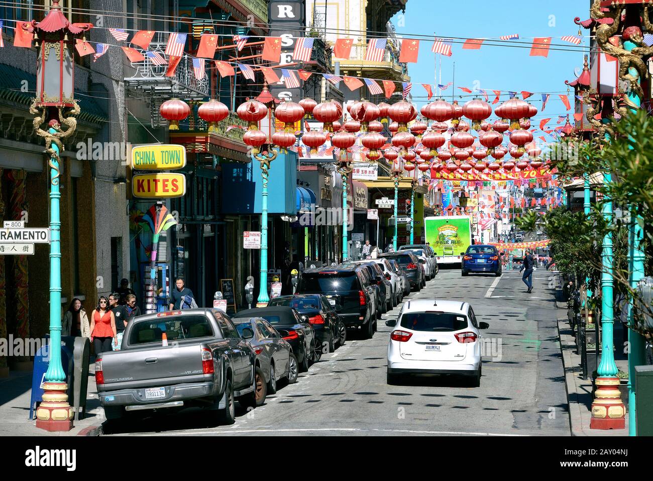 Grant Avenue with Chinese advertising, American and Chinese flags and lanterns in Chinatown, San Francisco, California, USA Stock Photo