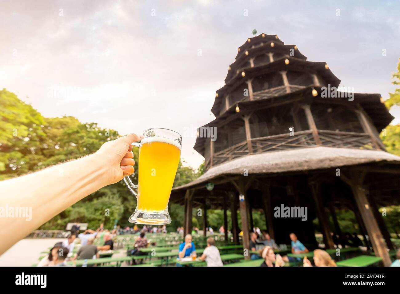 The Chinese tower in the English garden is a famous beer court in Munich. The concept of the Bavarian national dishes and drinks Stock Photo