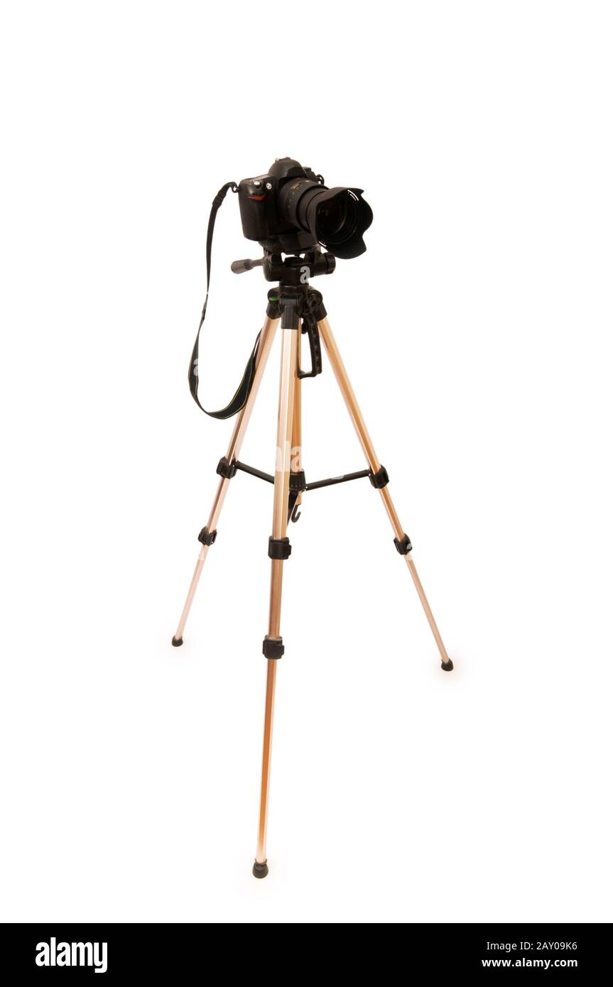 Tripod and camera isolated on the white background Stock Photo - Alamy