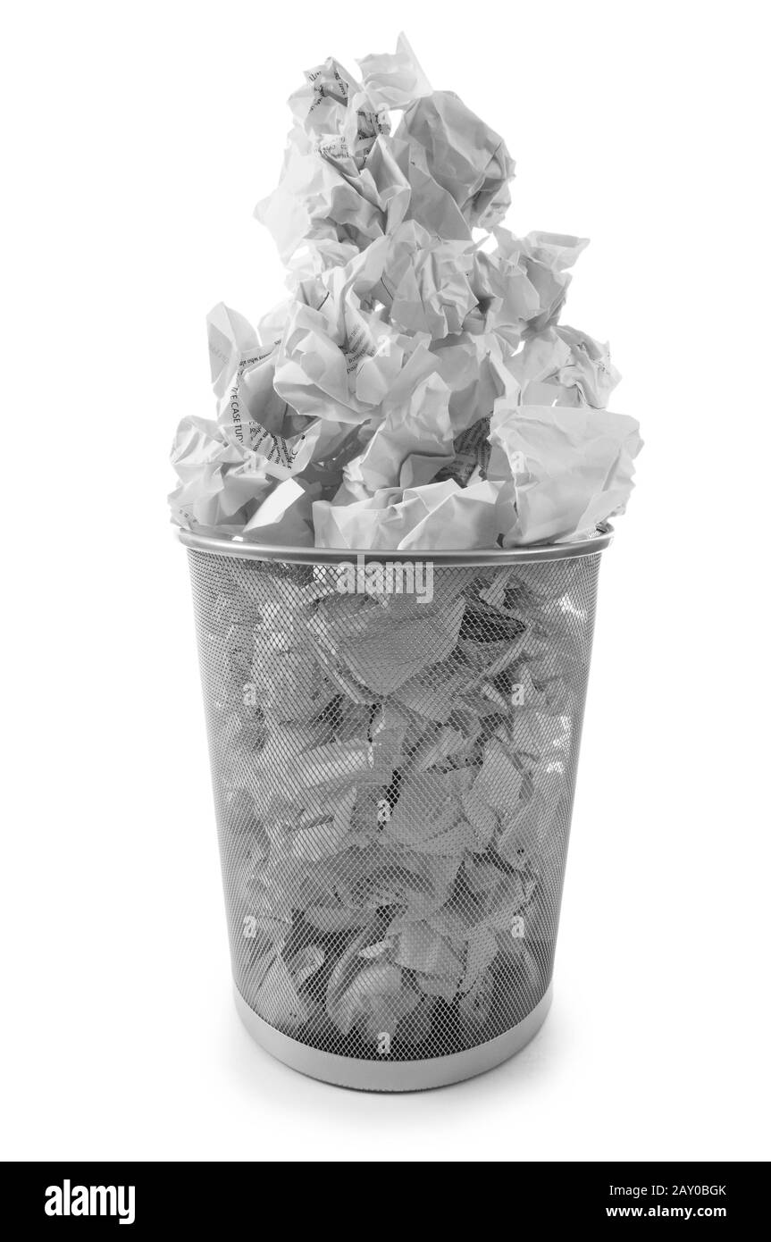 Garbage bin with paper waste isolated on white Stock Photo Alamy