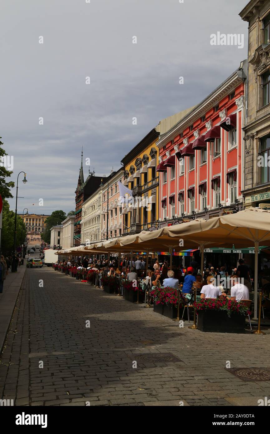 Crowded Karl Johans gate, Oslo, Norway. People sightseeing and relaxing in outdoors cafes Stock Photo