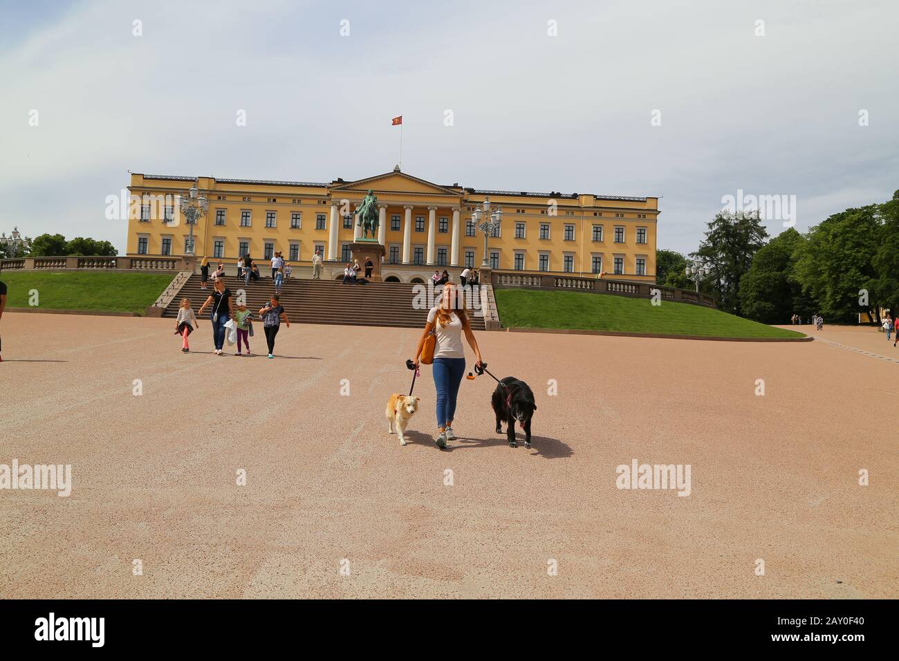 The Royal Palace in Oslo, the capital of Norway. People tourists walking on the palace grounds on a summer day Stock Photo