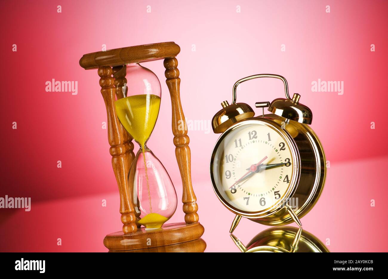 Time concept with clock and hour glass Stock Photo Alamy