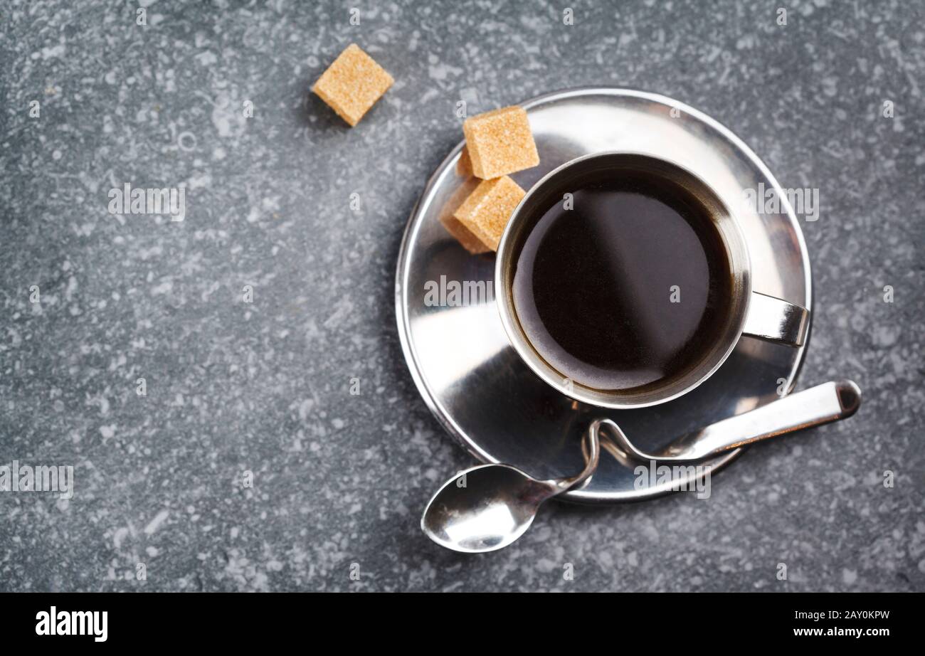 Cup of black coffee with sugar cubes Stock Photo
