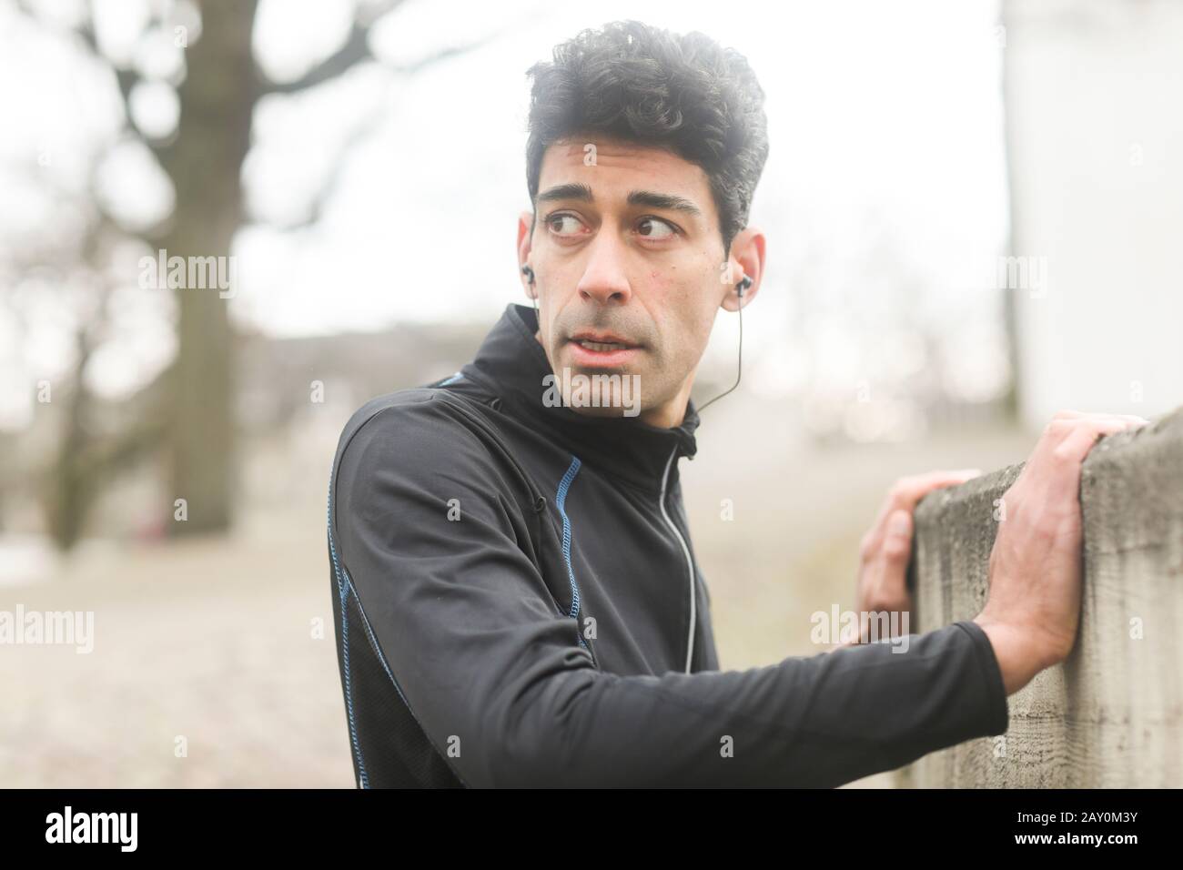 Portrait of a male jogger warming up outside, Germany Stock Photo
