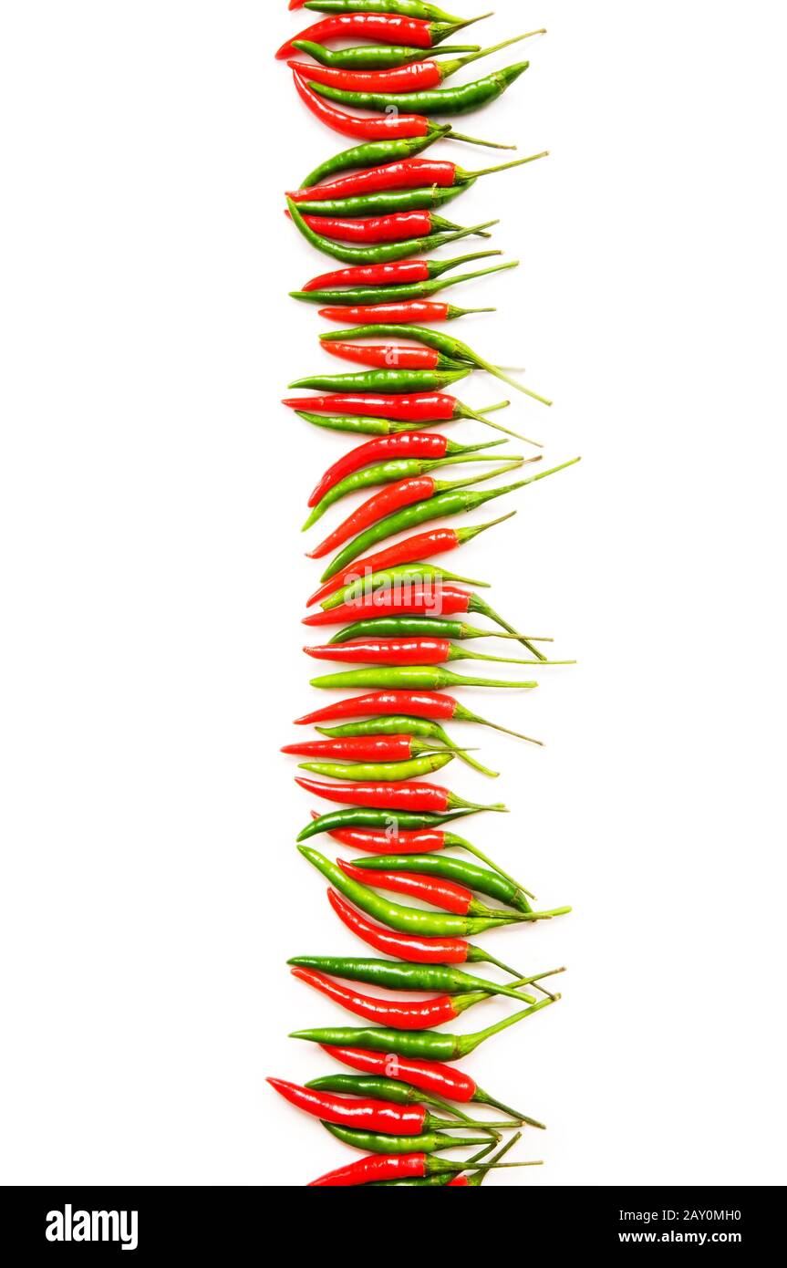 Red and green peppers isolated on white Stock Photo - Alamy
