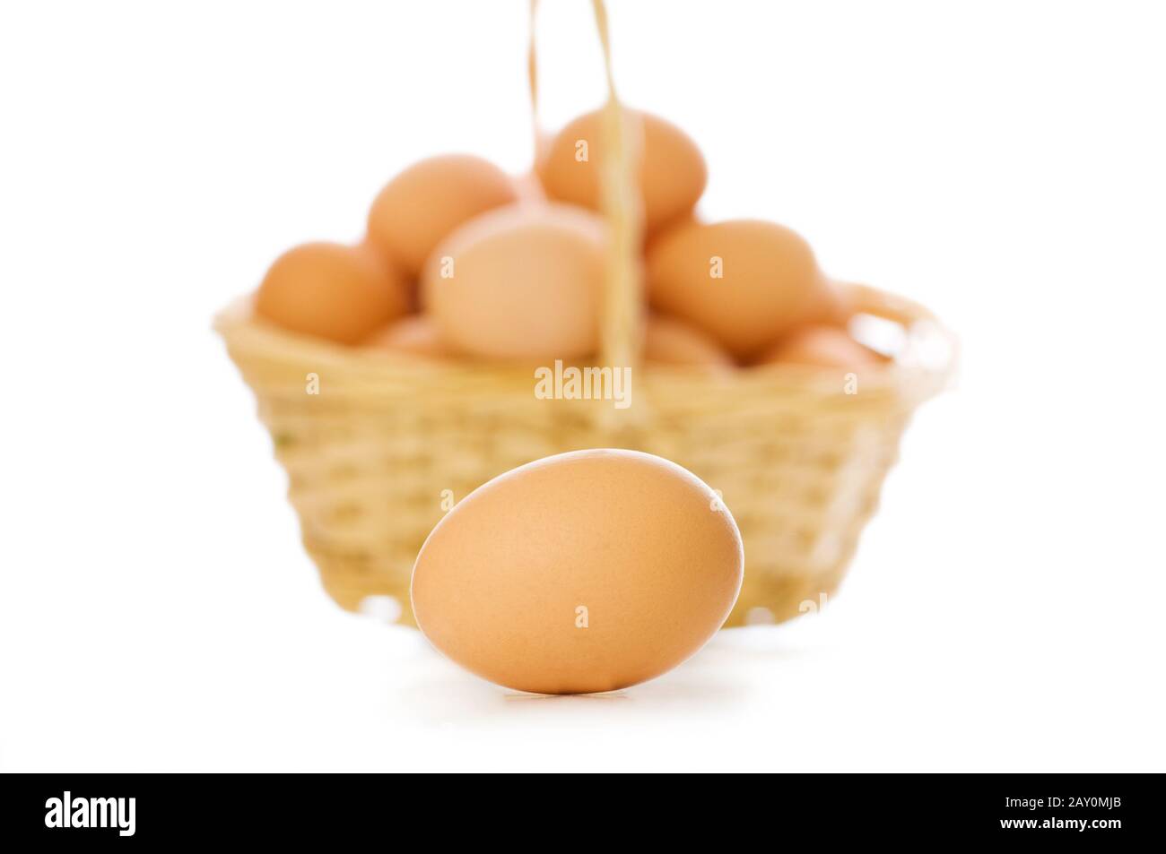 Egg and basket isolated on white Stock Photo Alamy