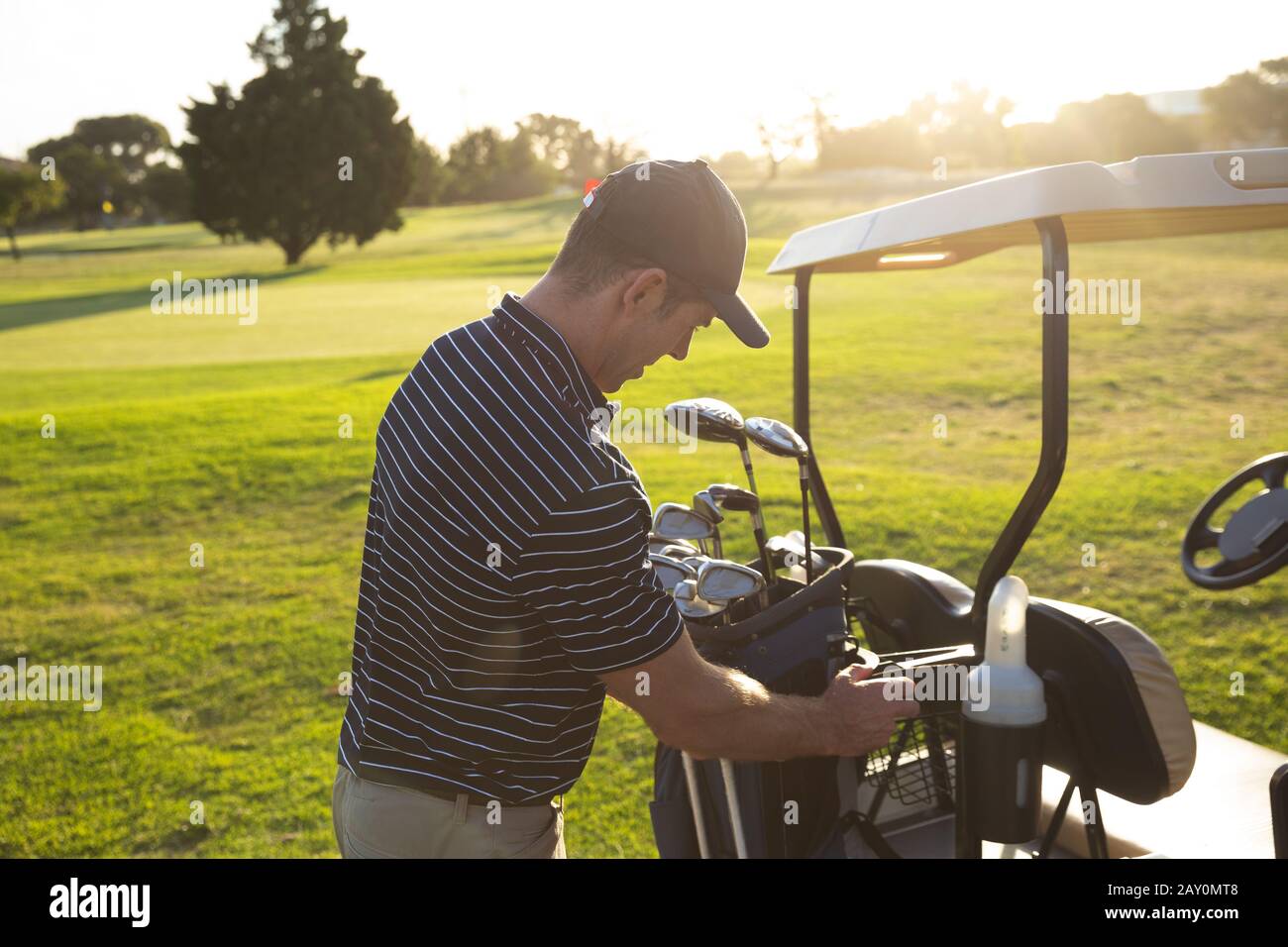 Golfer with golf bag Stock Photo Alamy