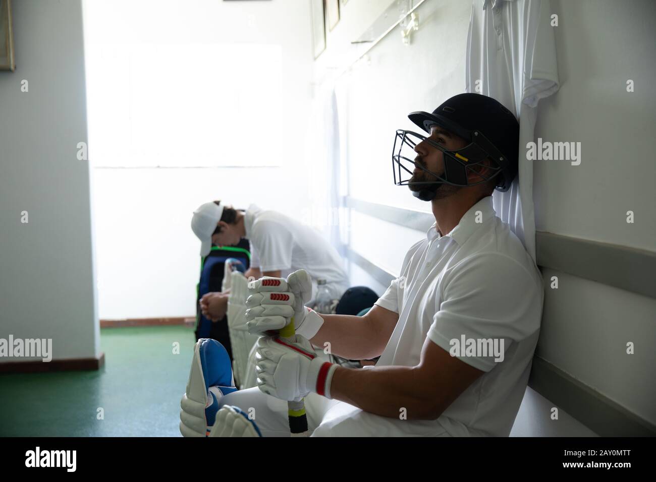 Cricket player waiting before playing Stock Photo