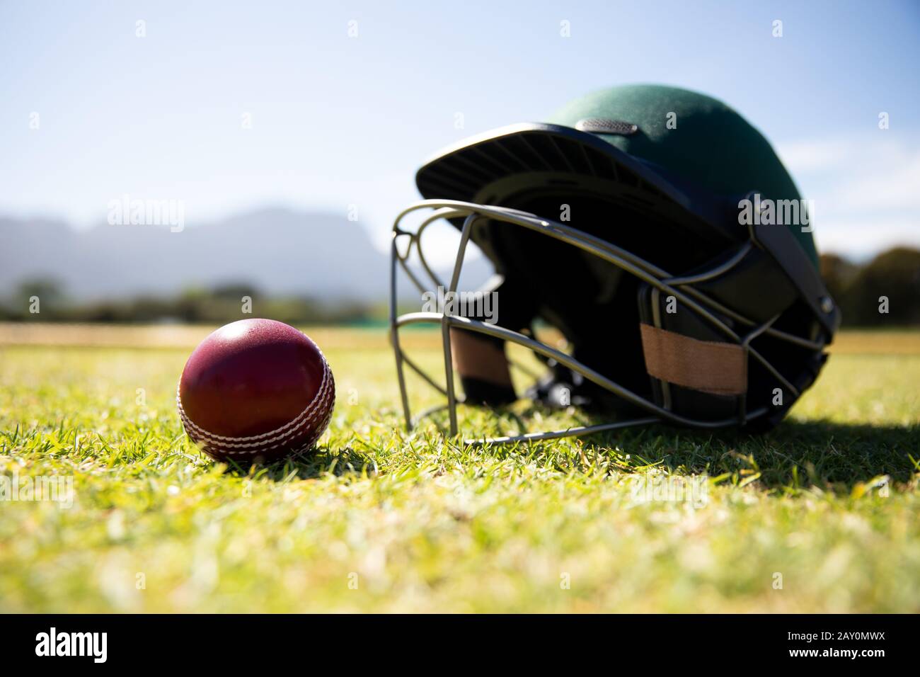 Cricket ball and helmet Stock Photo