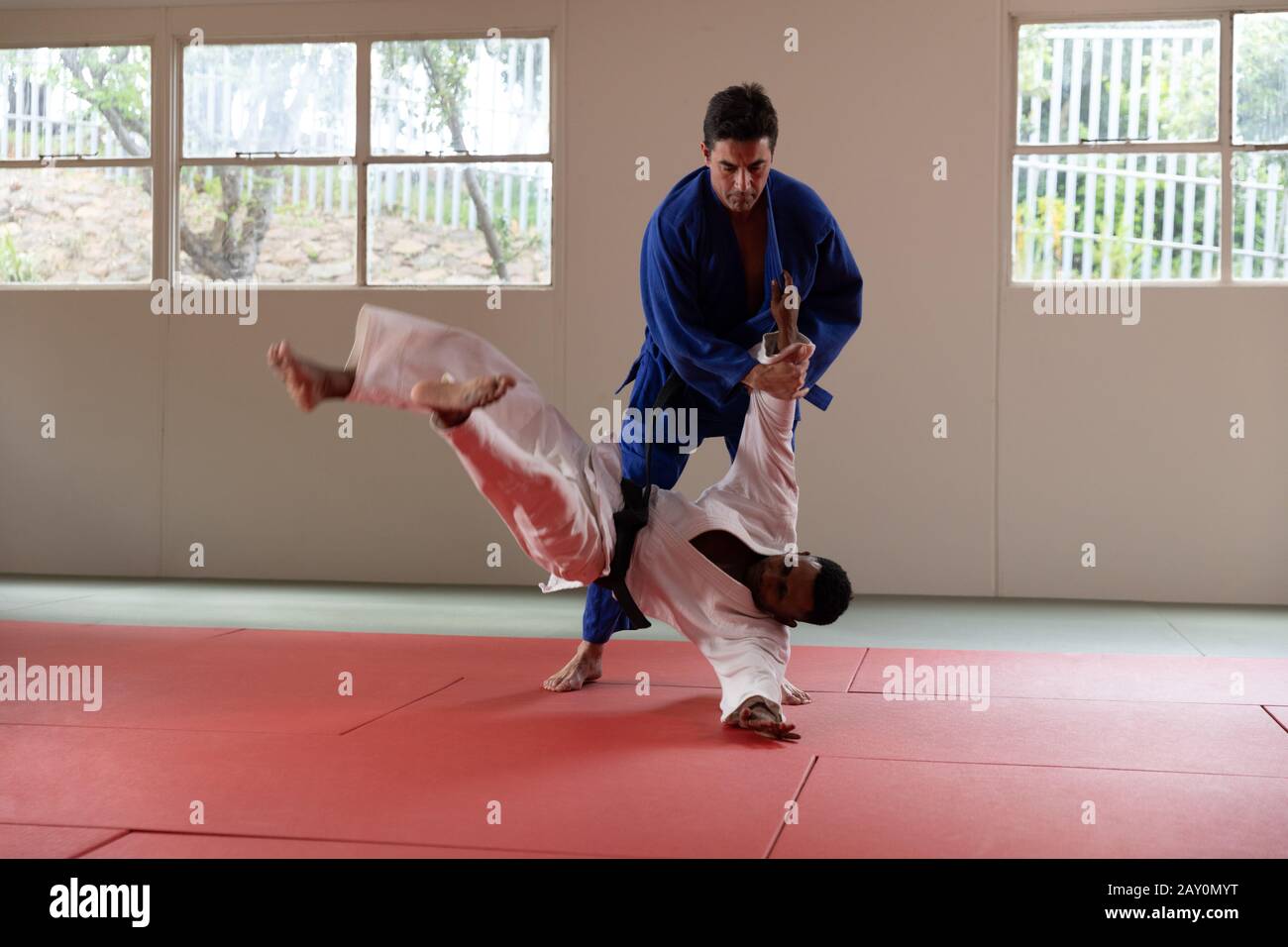 Judokas training in a gym Stock Photo