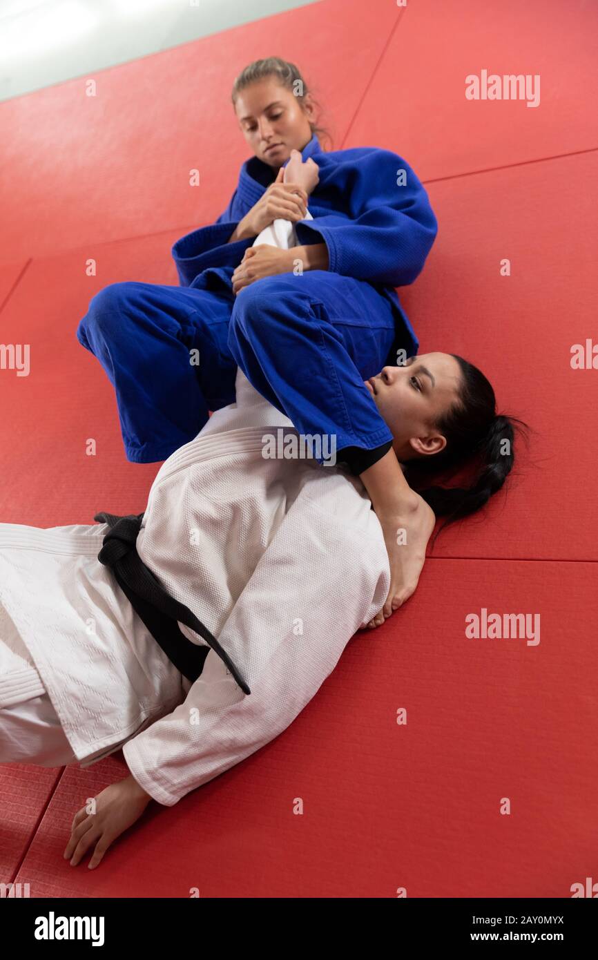 Judoka doing an arm lock Stock Photo Alamy