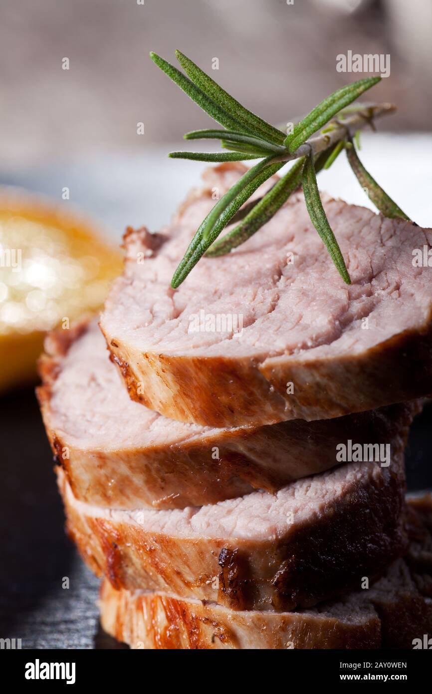 Pork tenderloin with rosemary Stock Photo Alamy