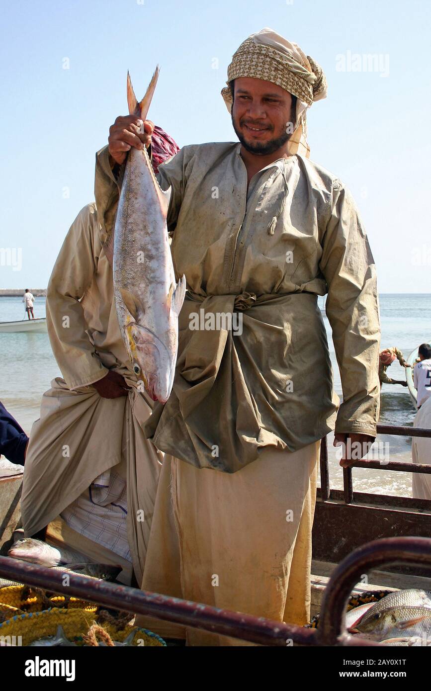 Fish traders in Oman Stock Photo Alamy