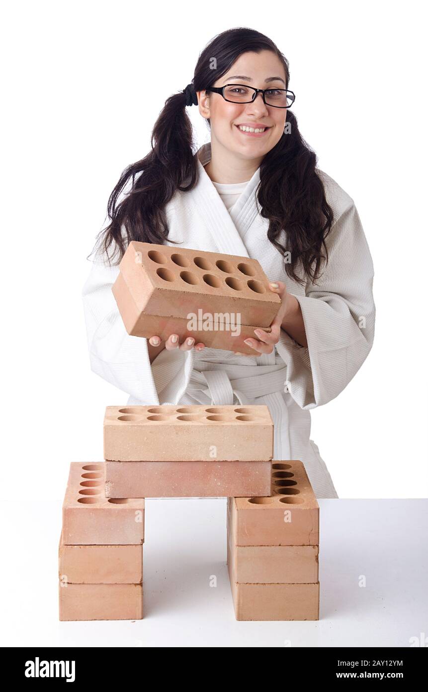 Woman karate breaking bricks on white Stock Photo Alamy