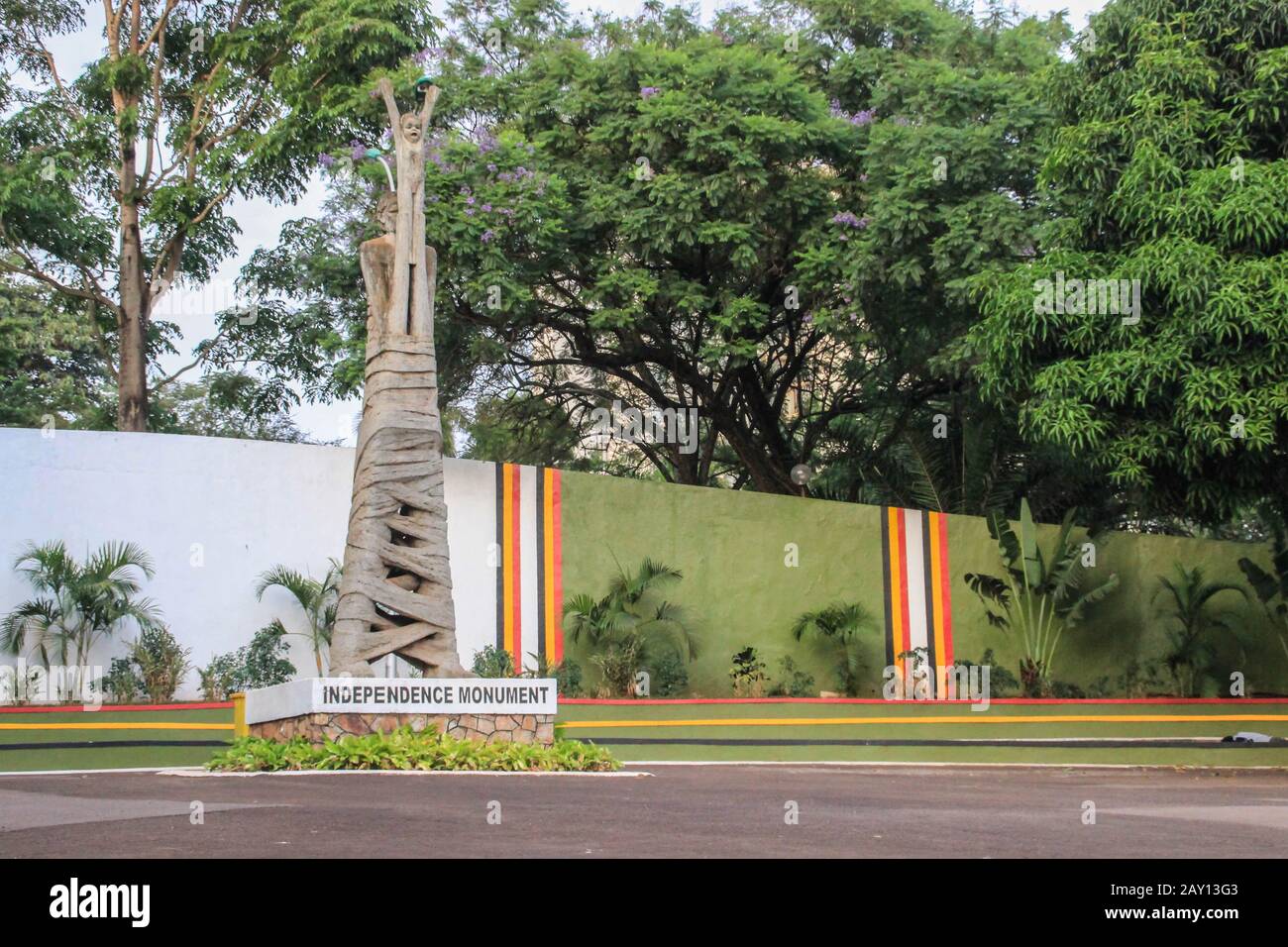 Kampala, Uganda - January 21, 2015: Monument of Independence. A woman with tied legs holding a baby in her arms. Stock Photo