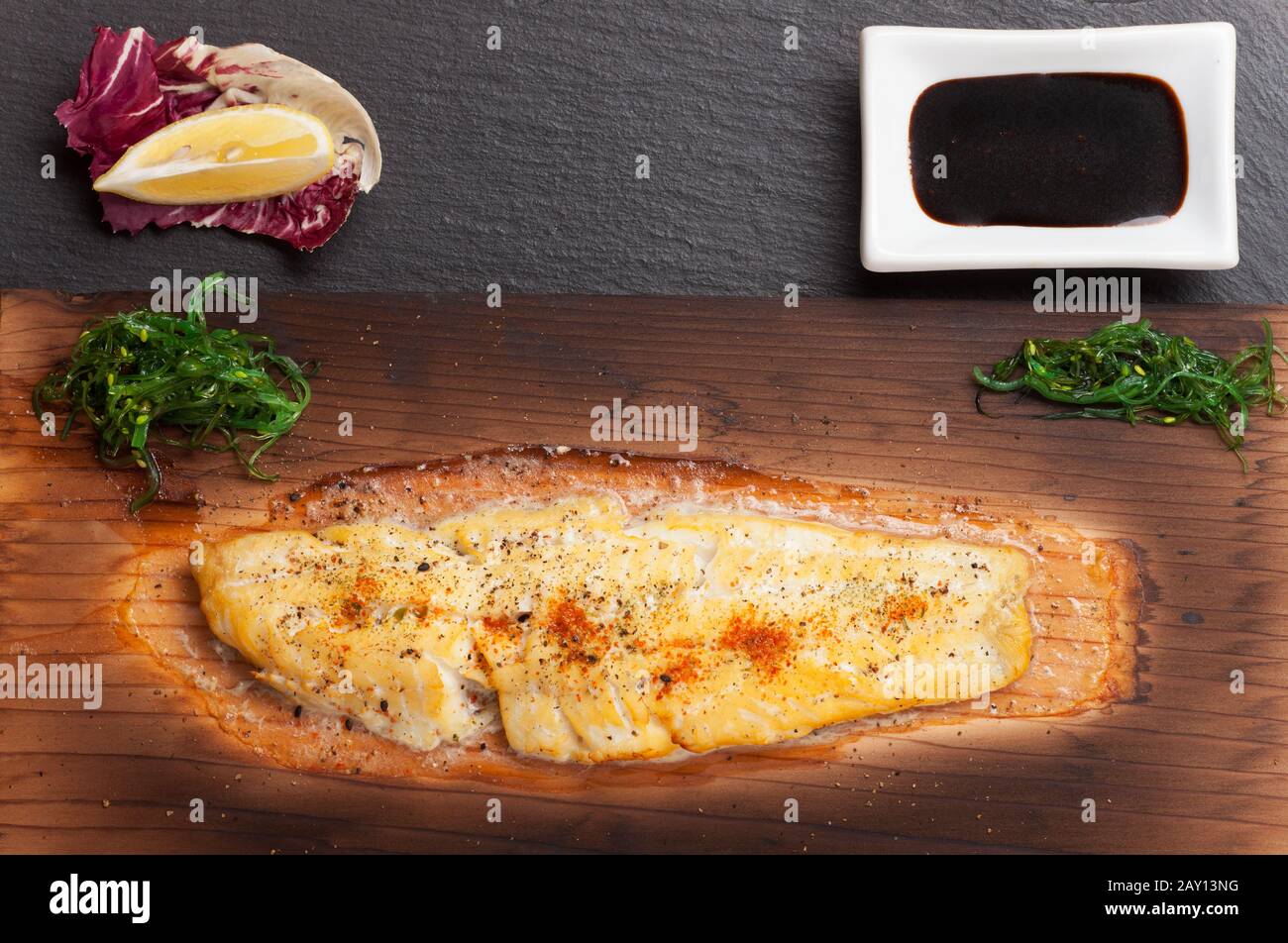 Sole on a barbecue plank Stock Photo Alamy