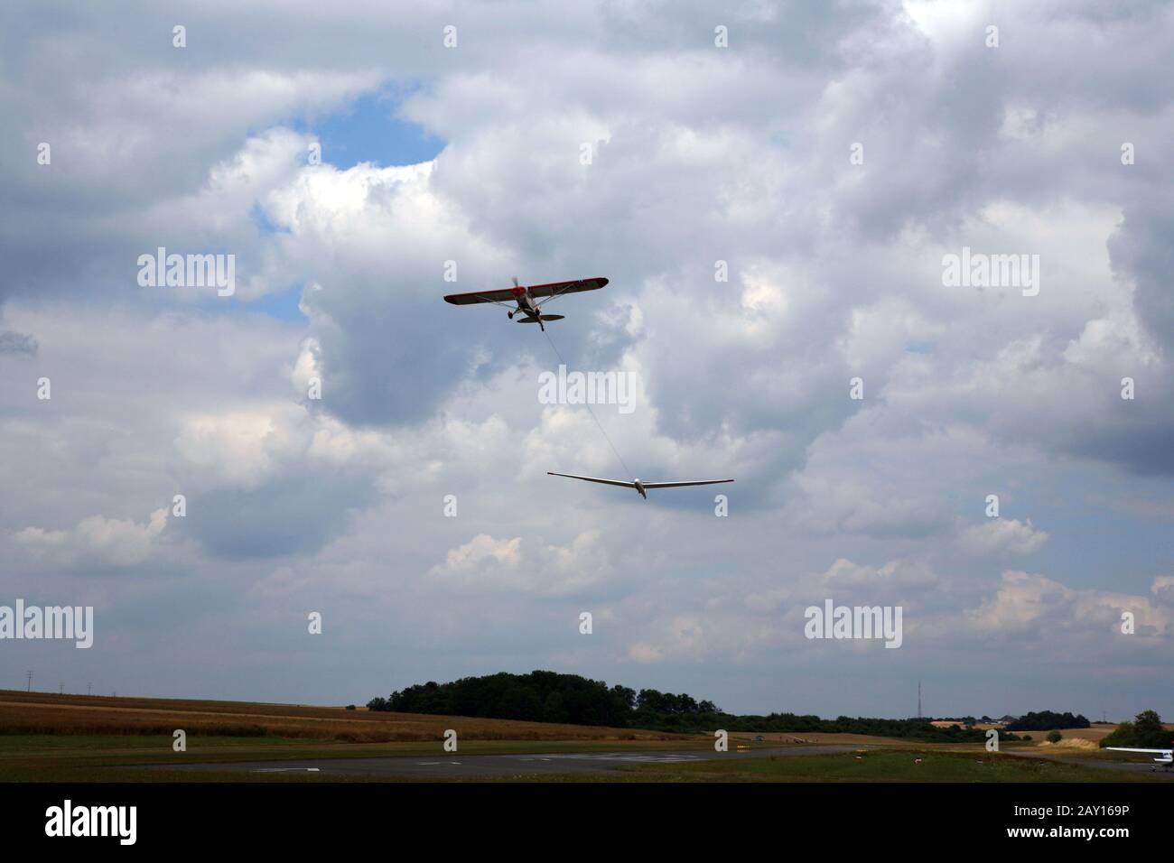 Glider is pulled into the air by a powered aircraft during takeoff