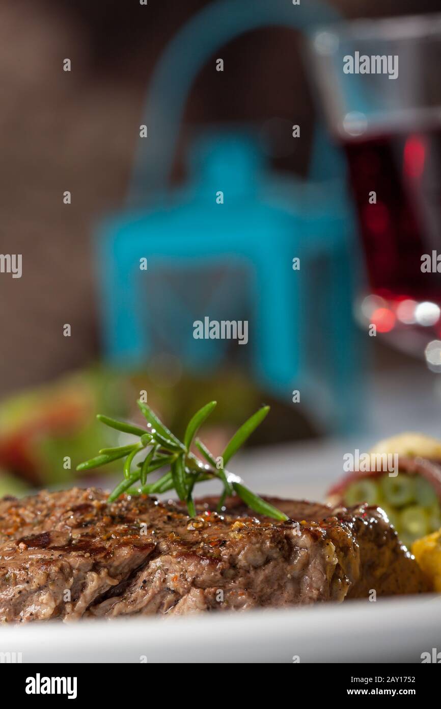 Steak with a sprig of rosemary Stock Photo Alamy