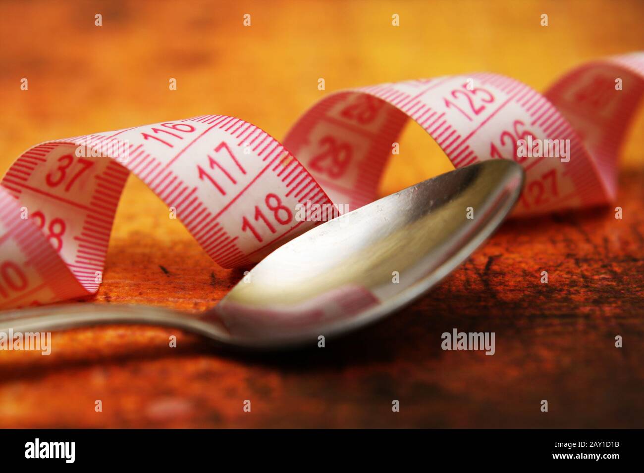 https://c8.alamy.com/comp/2AY1D1B/spoon-and-measure-tape-2AY1D1B.jpg