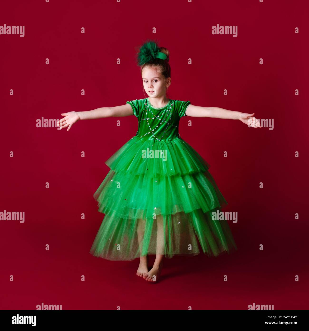 Beautiful Little Girl Princess Dancing In Luxury Green Dress Isolated beautiful-little-girl-princess-dancing-in-luxury-green-dress-isolated