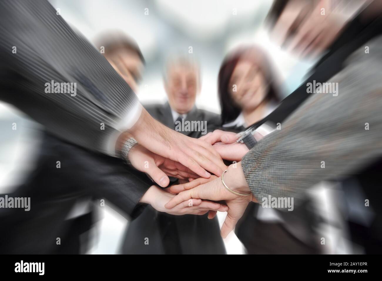 Unity And Partnership Group of business people with hands together for unity and partnership ...
