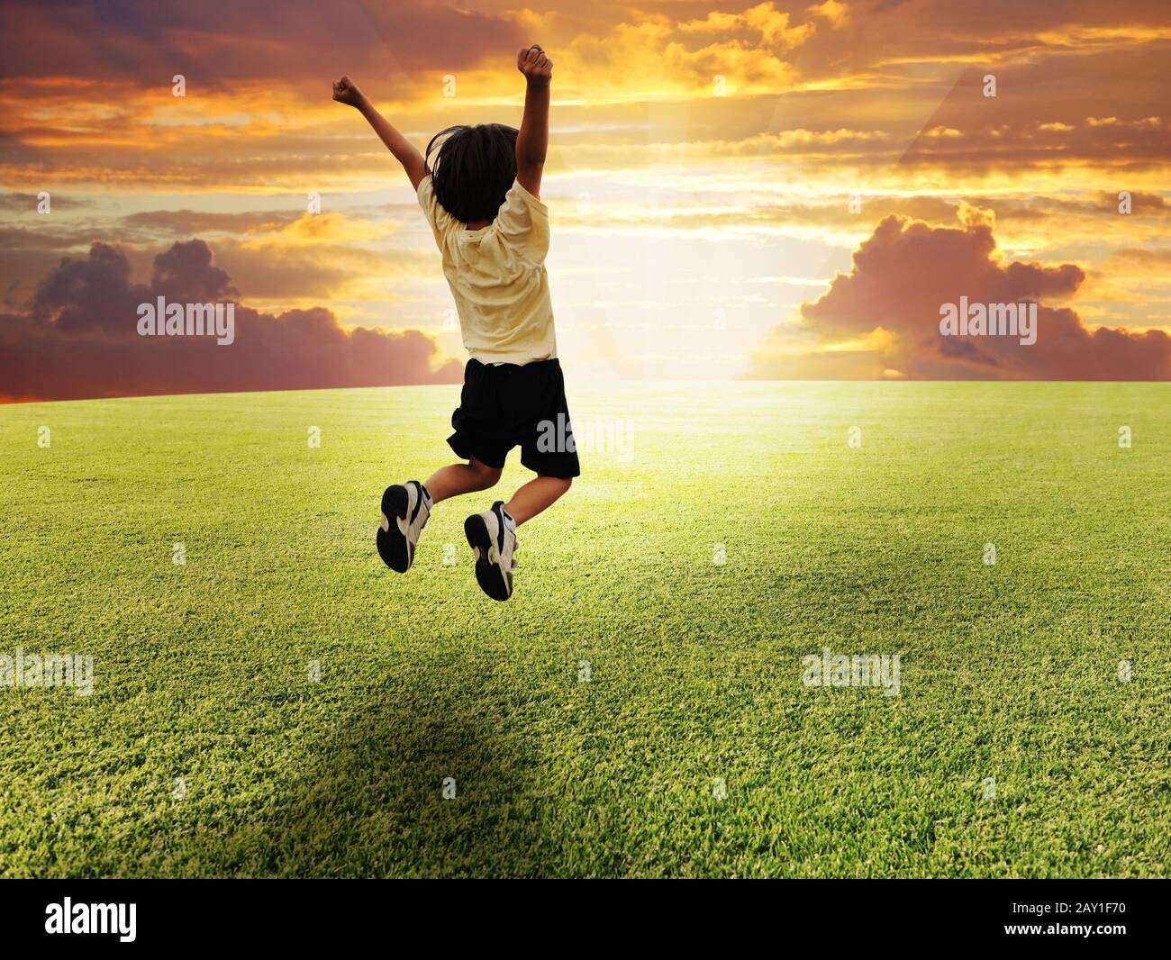 Child jumping hi-res stock photography and images - Alamy