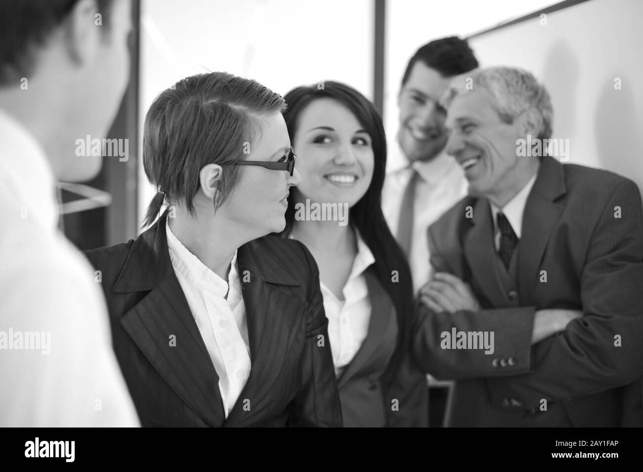 Office workers smiling in meeting Black and White Stock Photos & Images ...