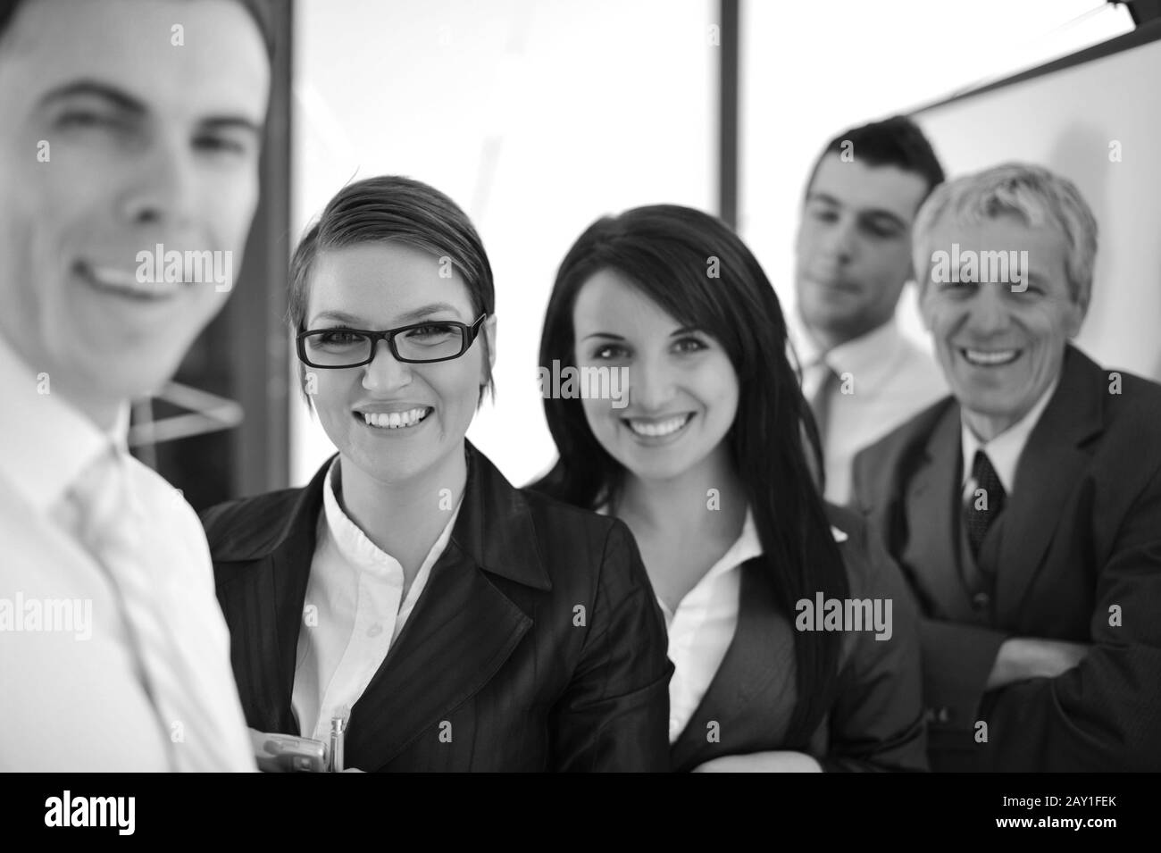 Happy smiling business team Stock Photo - Alamy