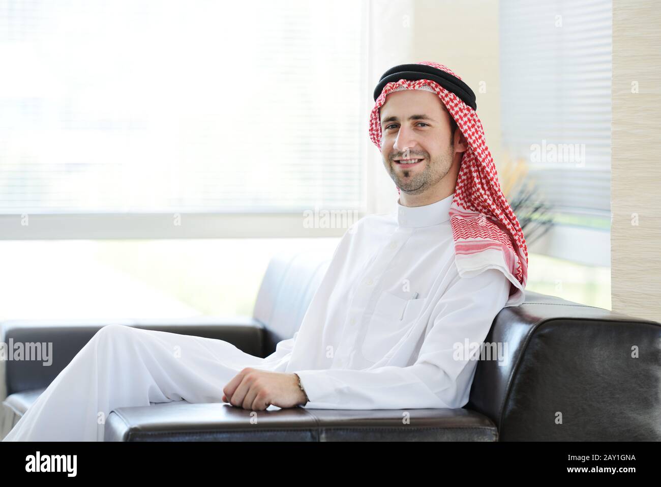 Arabic adult sitting in office Stock Photo