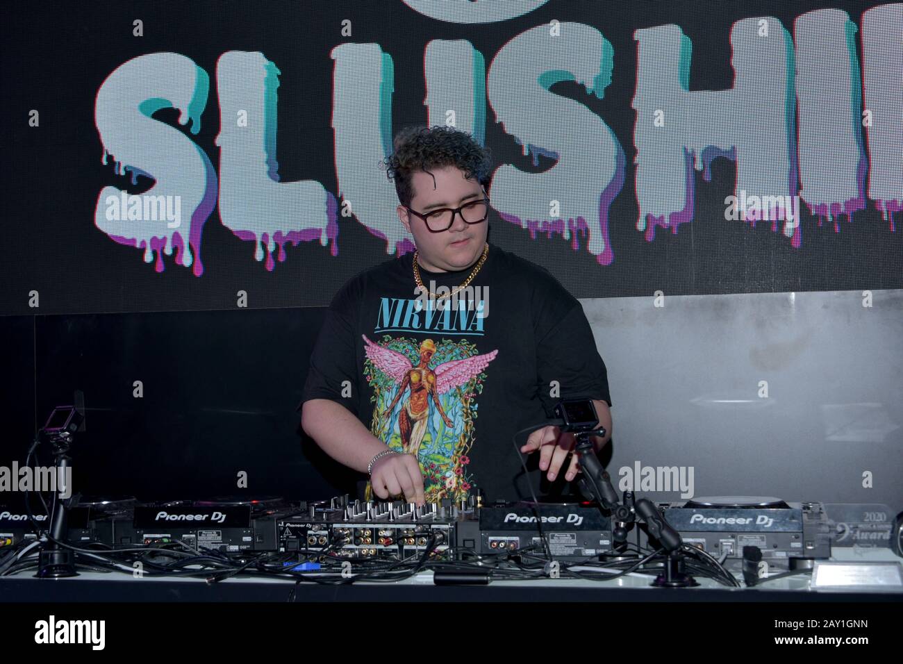 mMODEL WEARING SOLID PURPLE DRESS Stock Photo