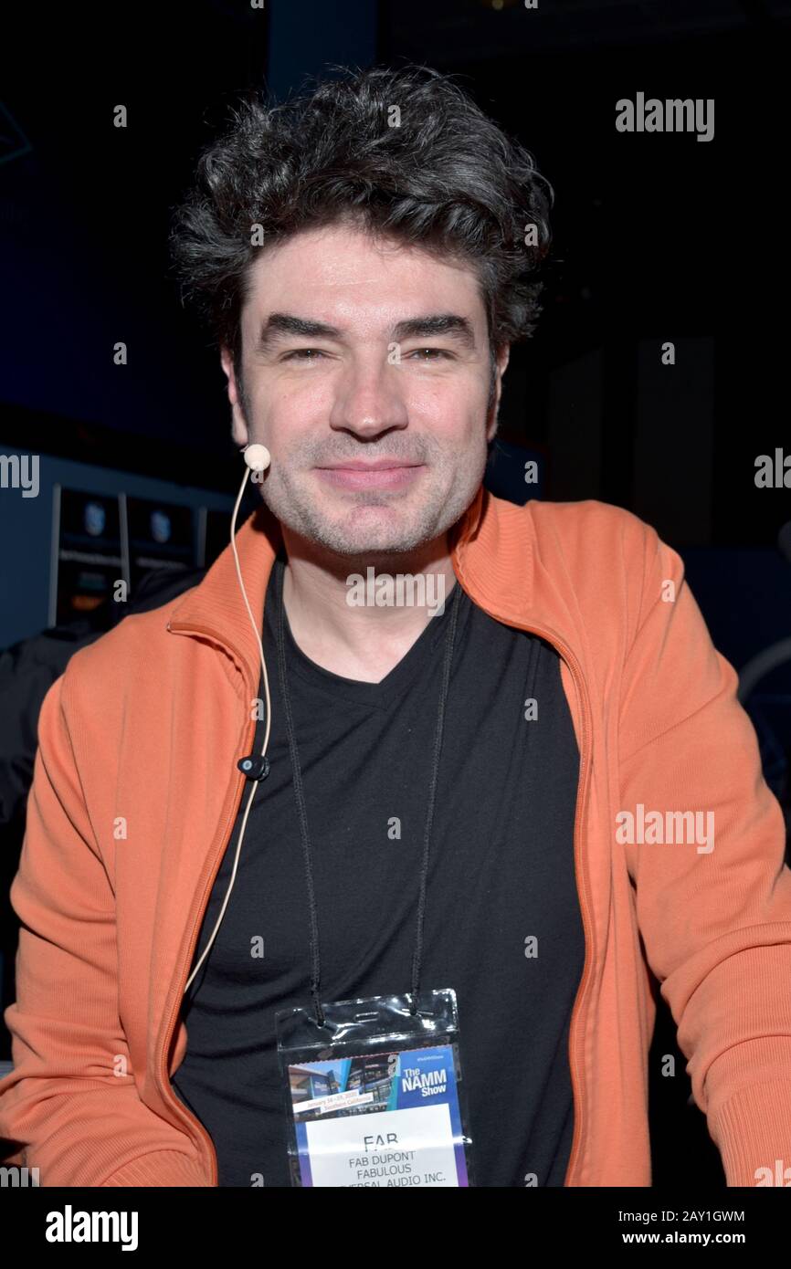 mMODEL WEARING SOLID PURPLE DRESS Stock Photo