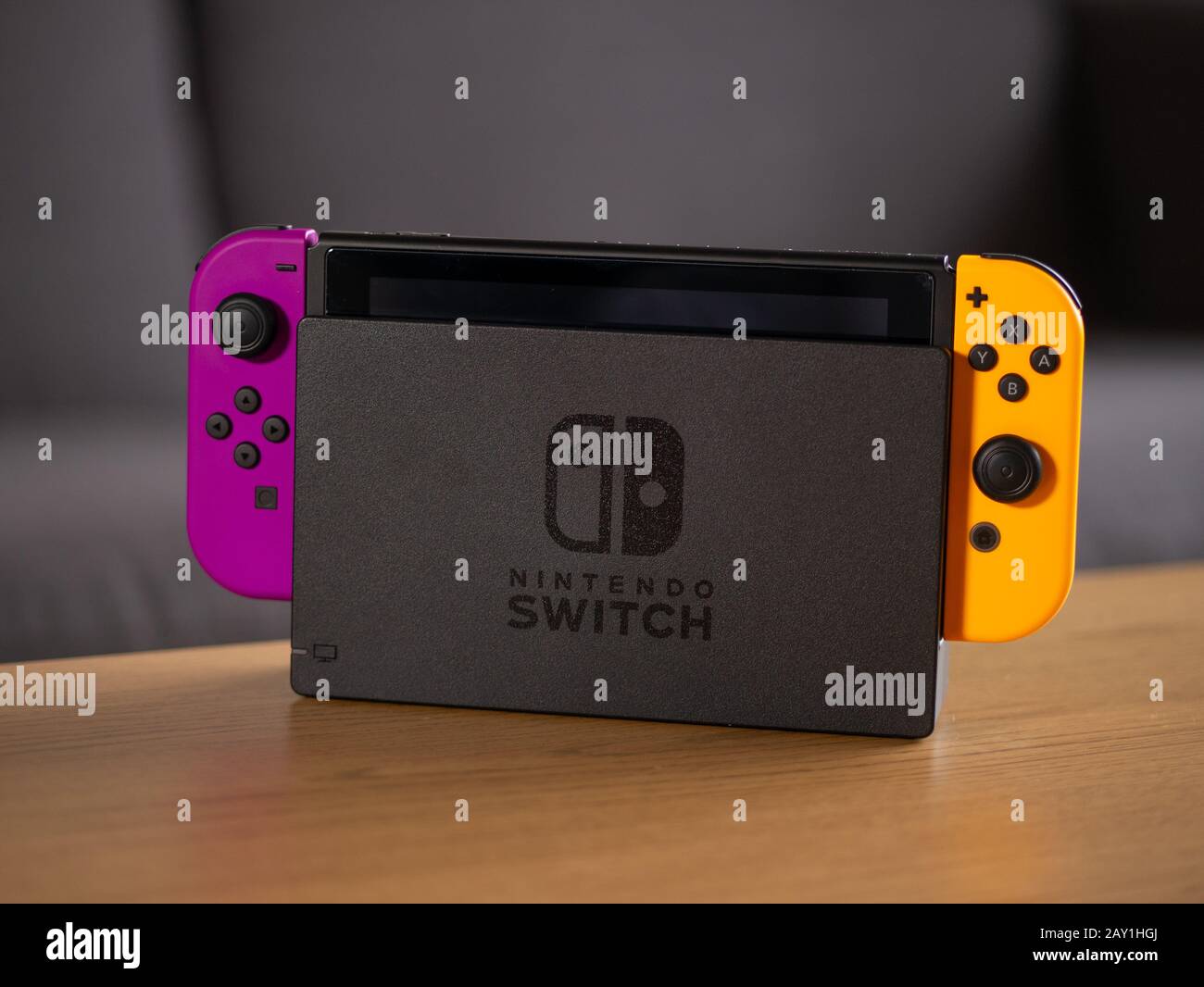 UK - Feb 2020: Nintendo switch purple and orange joy con and portable  console in home Stock Photo - Alamy