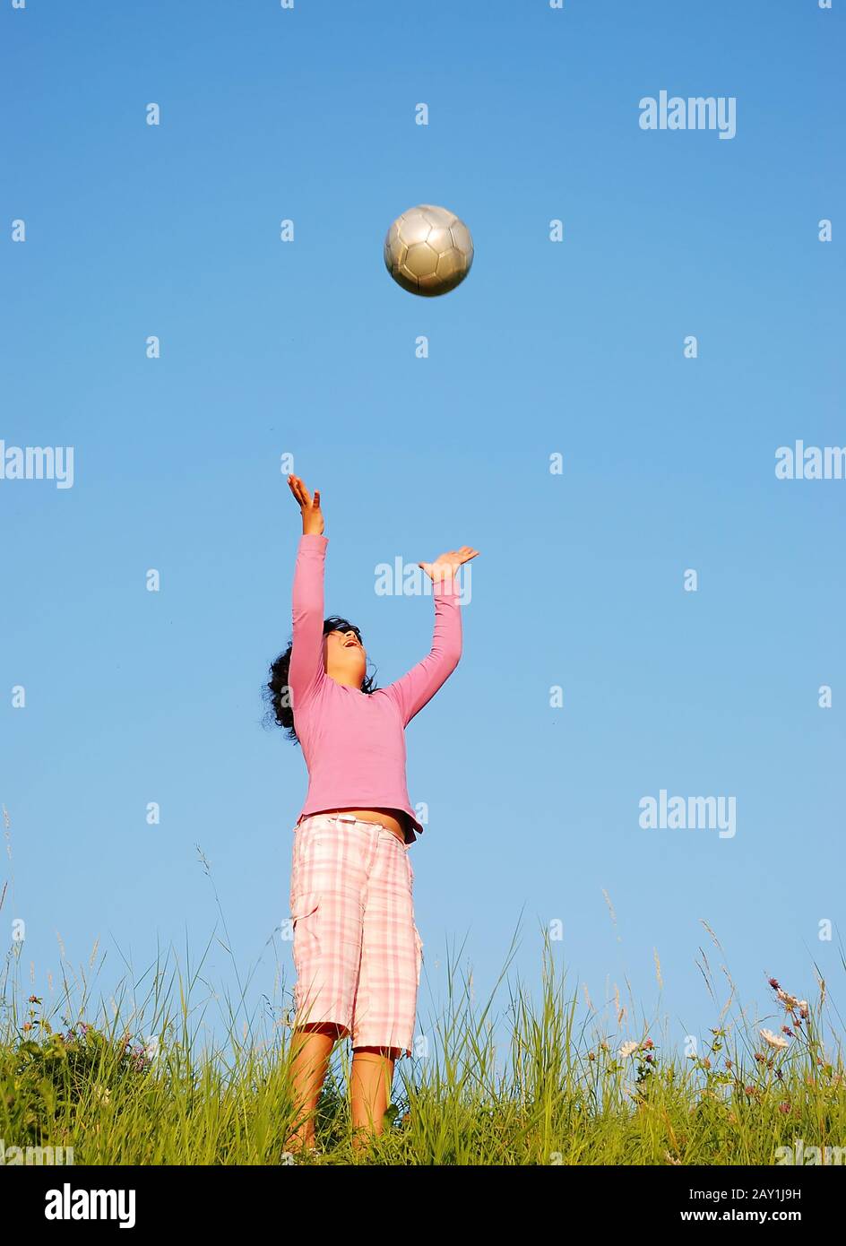Happy cute girl playing in nature Stock Photo - Alamy