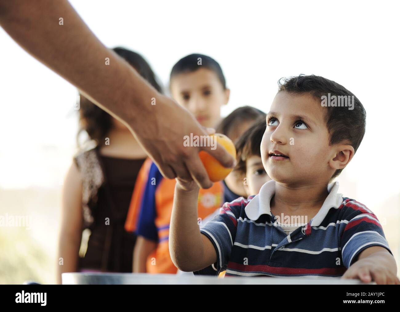 Hungry children in refugee camp Stock Photo