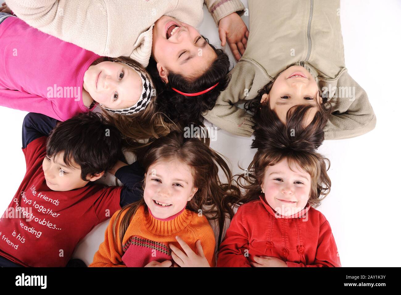Group happy kids laying in hi-res stock photography and images - Alamy