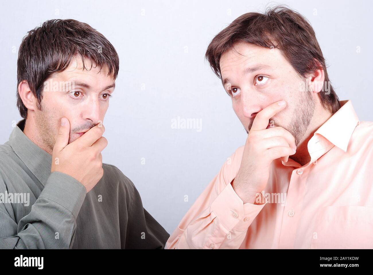 Two worried man with interesting excited faces Stock Photo