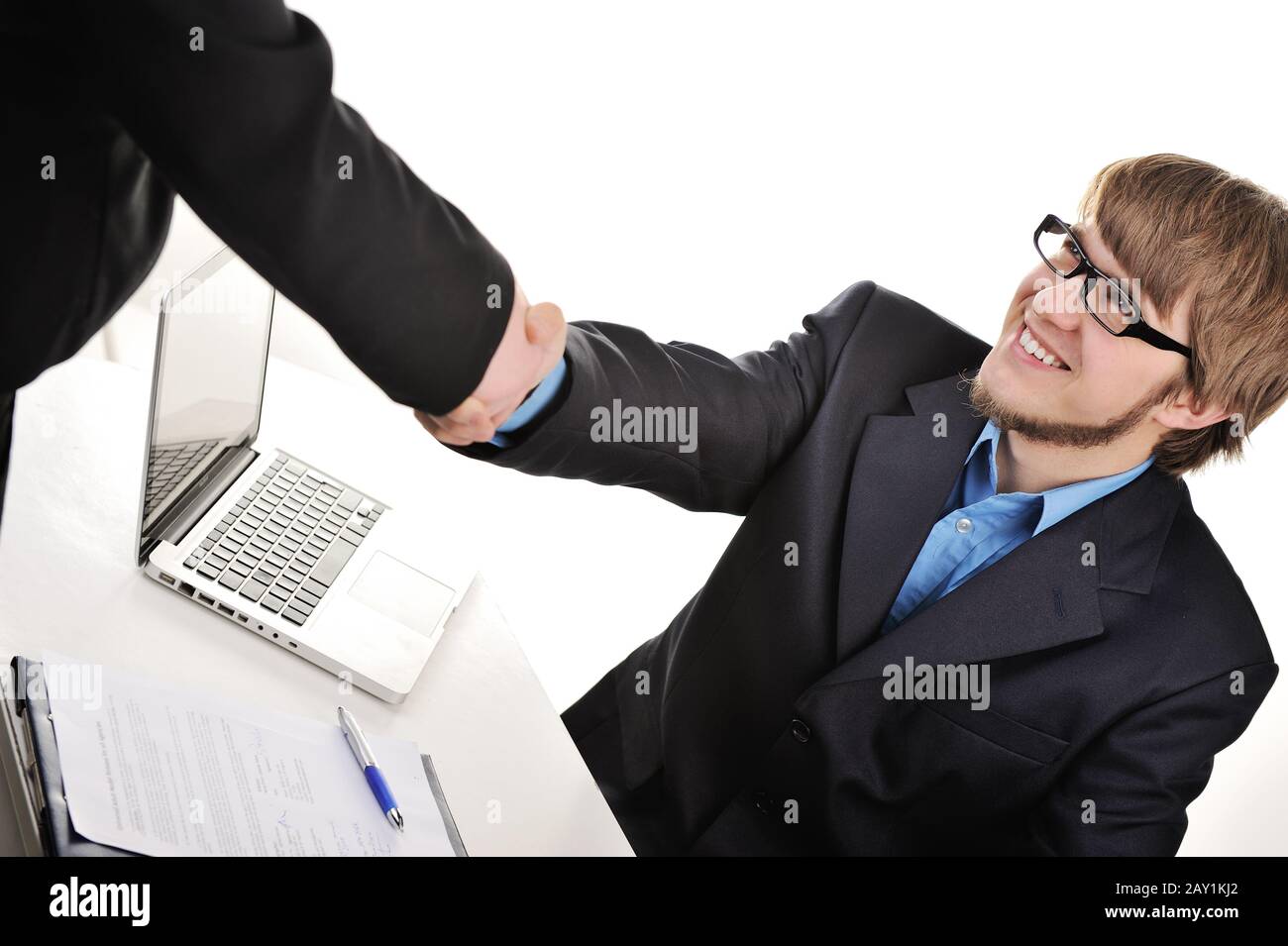 Young handsome businessman shaking hands Stock Photo
