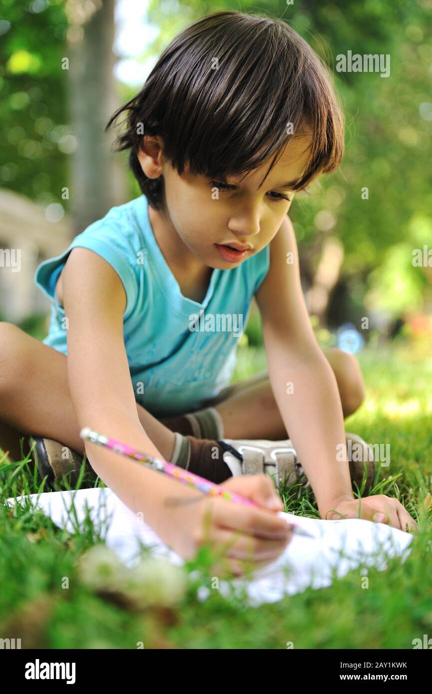 writing kid boy Stock Photo - Alamy