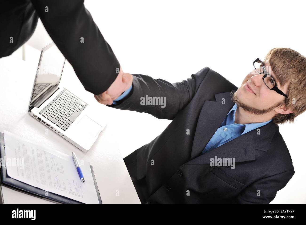 Handsome businessman shaking hands Stock Photo
