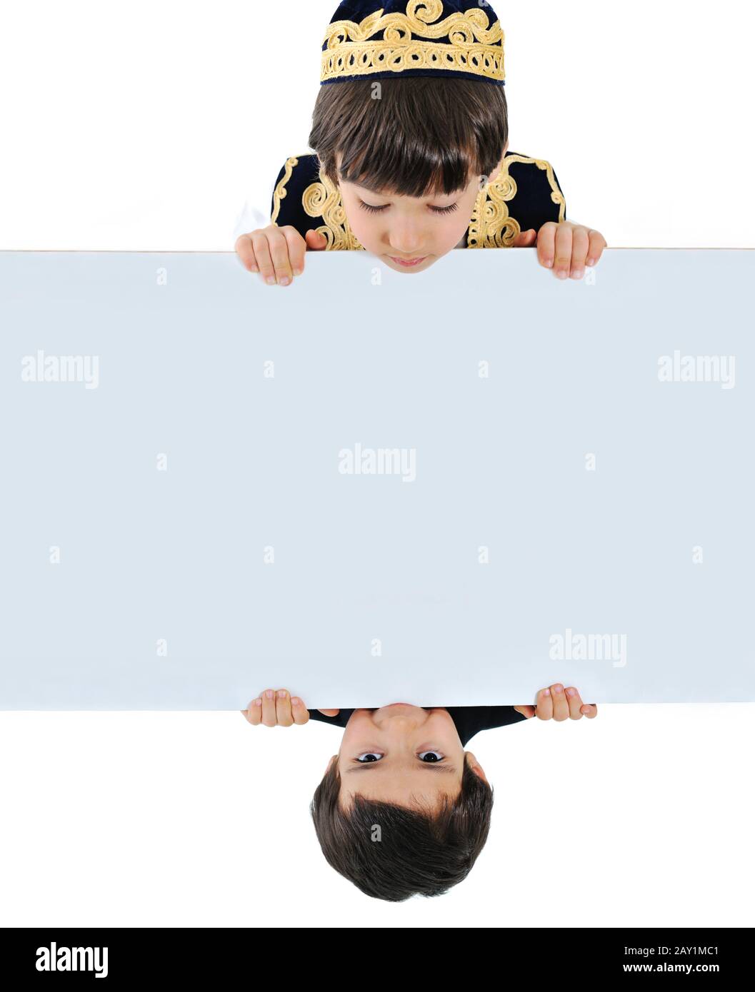 Two kids holding white banner Stock Photo - Alamy