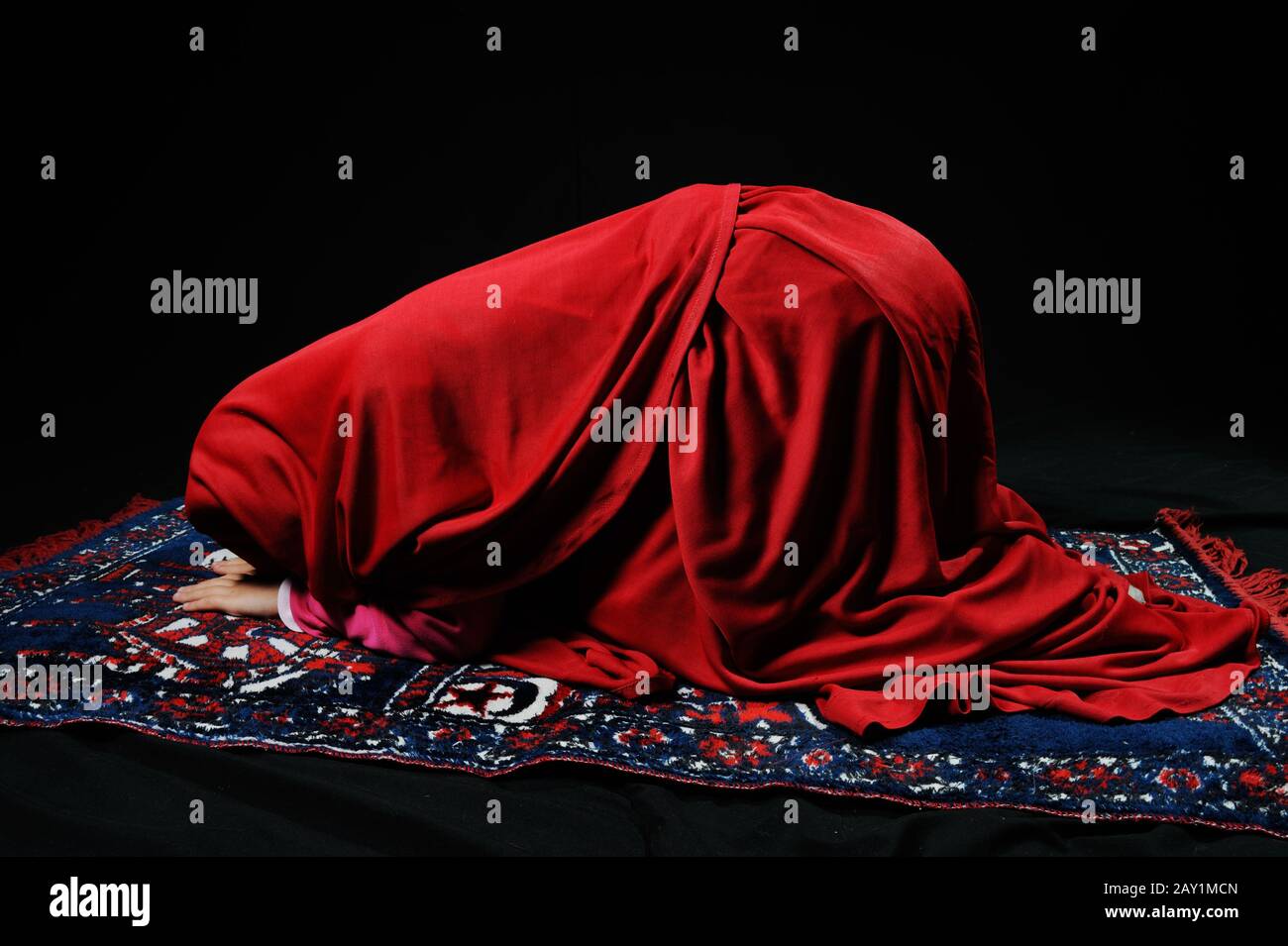Muslim girl praying Stock Photo