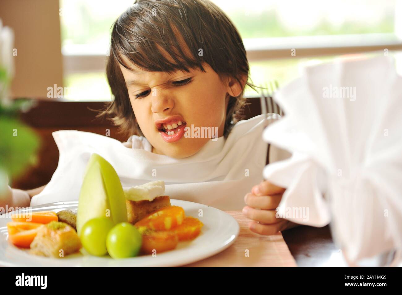 Refusing food, kid does not want to eat Stock Photo