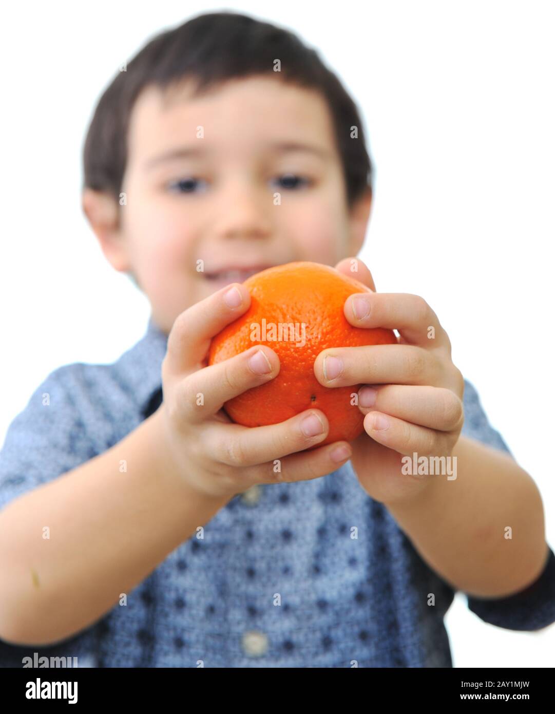 Little kid holding fresh oranges Stock Photo Alamy