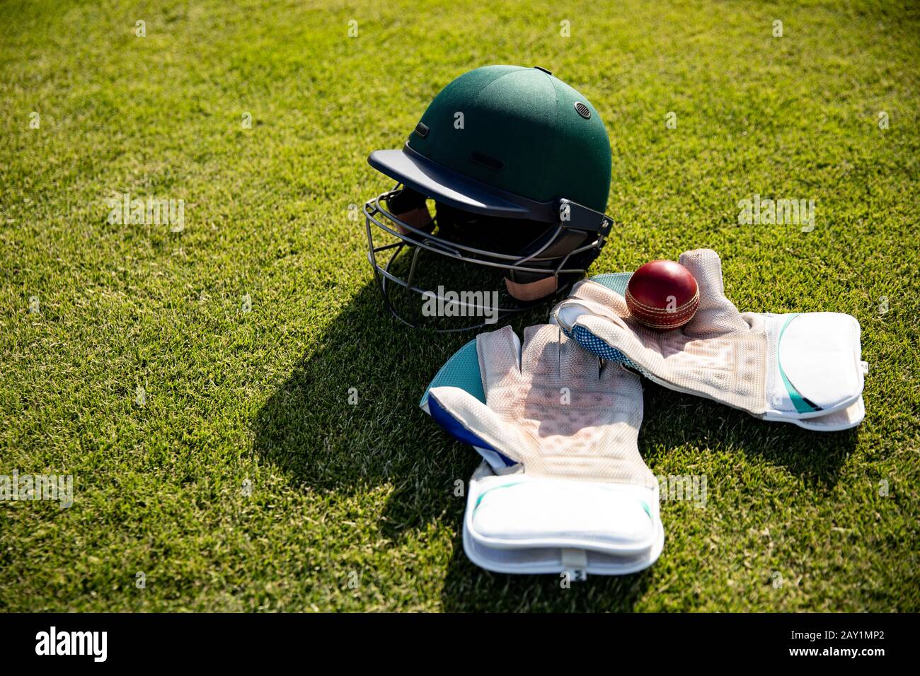 Cricket ball and helmet Stock Photo