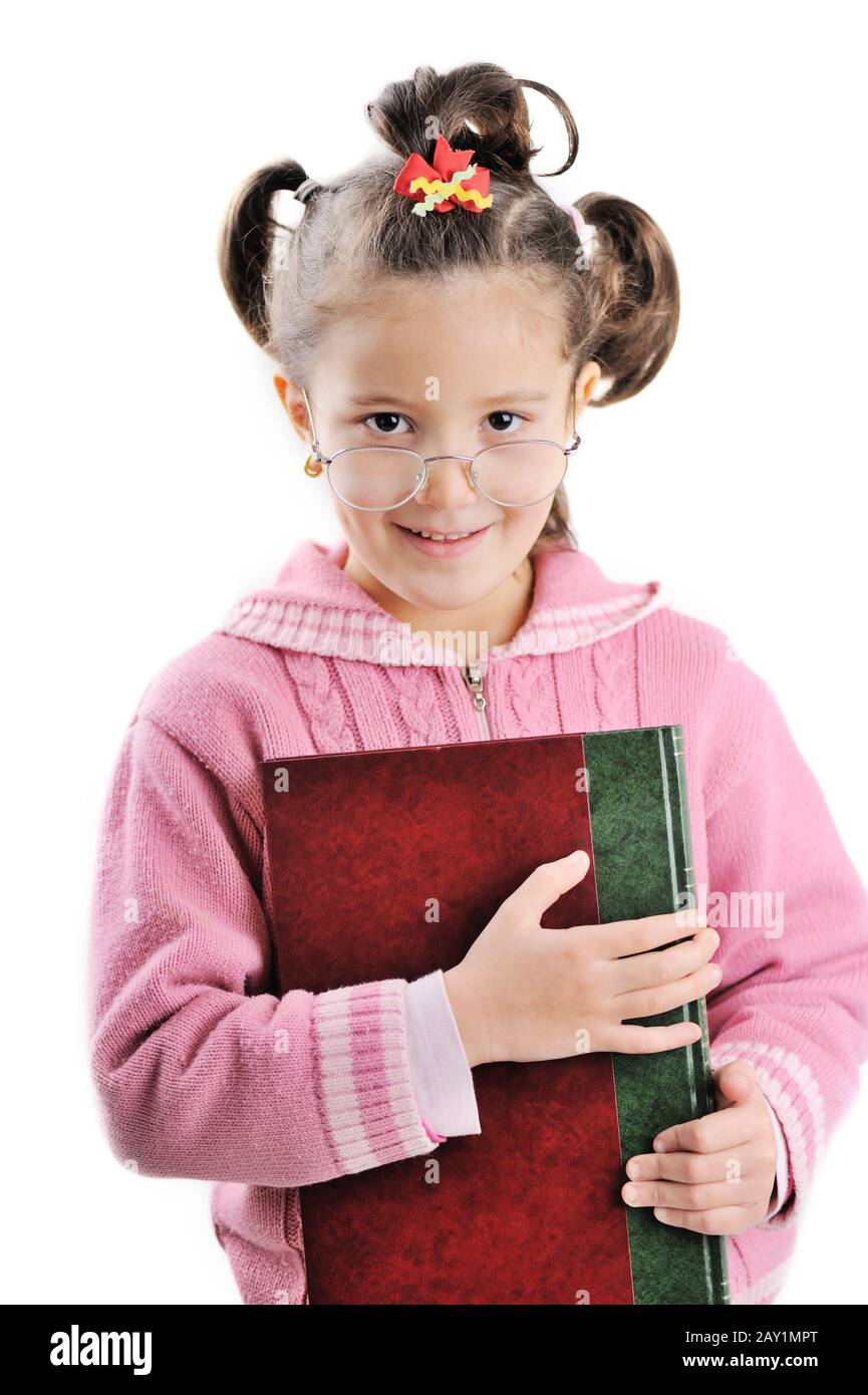 Little girl holding book Stock Photo - Alamy